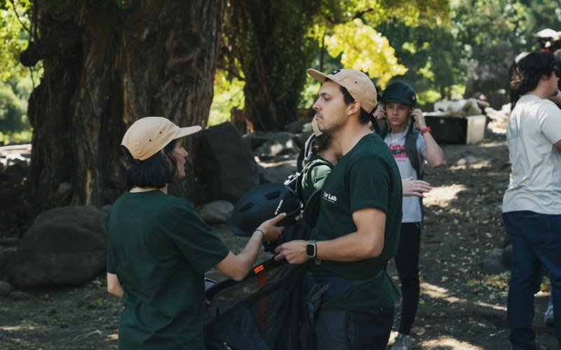 Rider being fitted with a helmet before the horseback ride